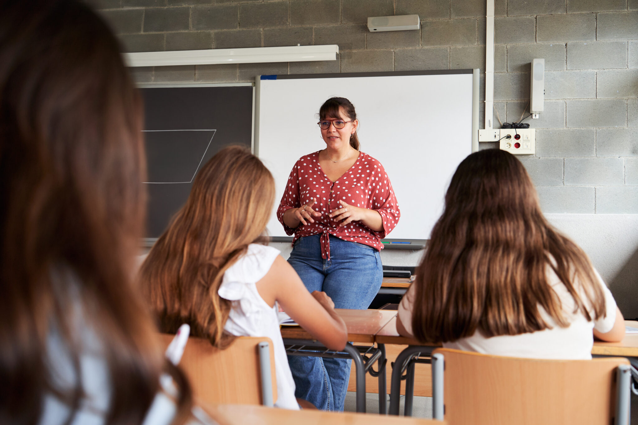 High school teacher explaining addiction prevention to students