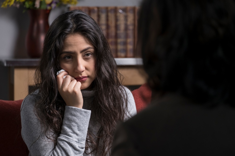 Private therapy session with woman dealing with trauma