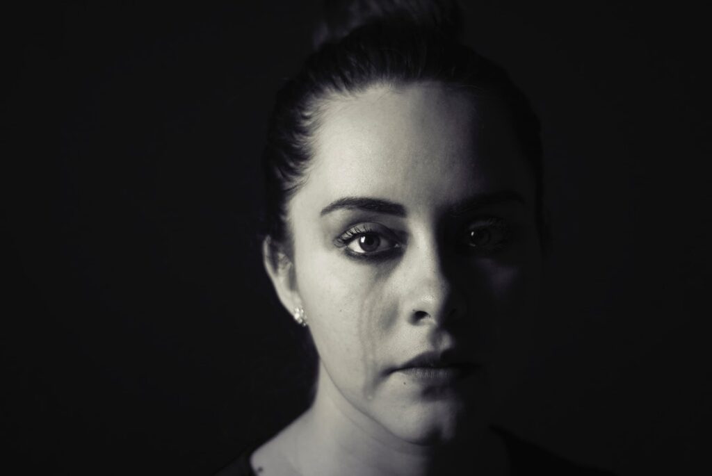Visual representation of a woman affected by trauma