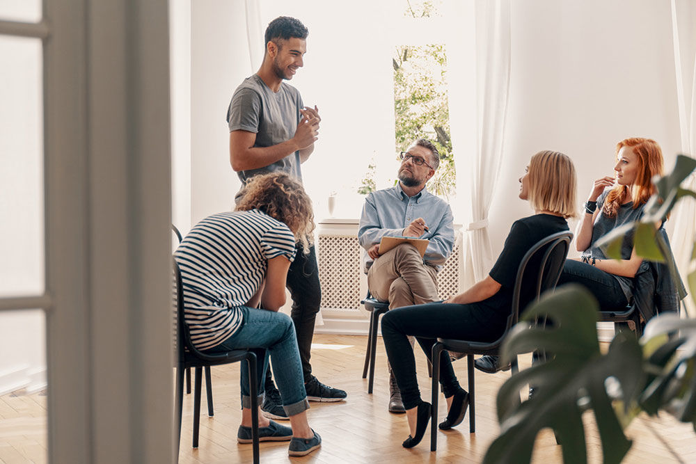 A man discussing Types of Adult Peer Pressure in Recovery